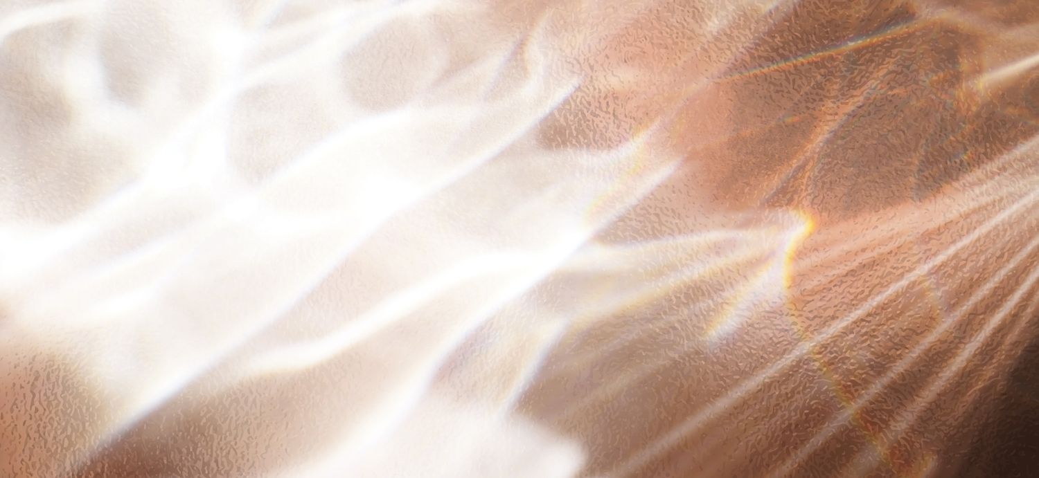 Abstract light patterns on textured surface.