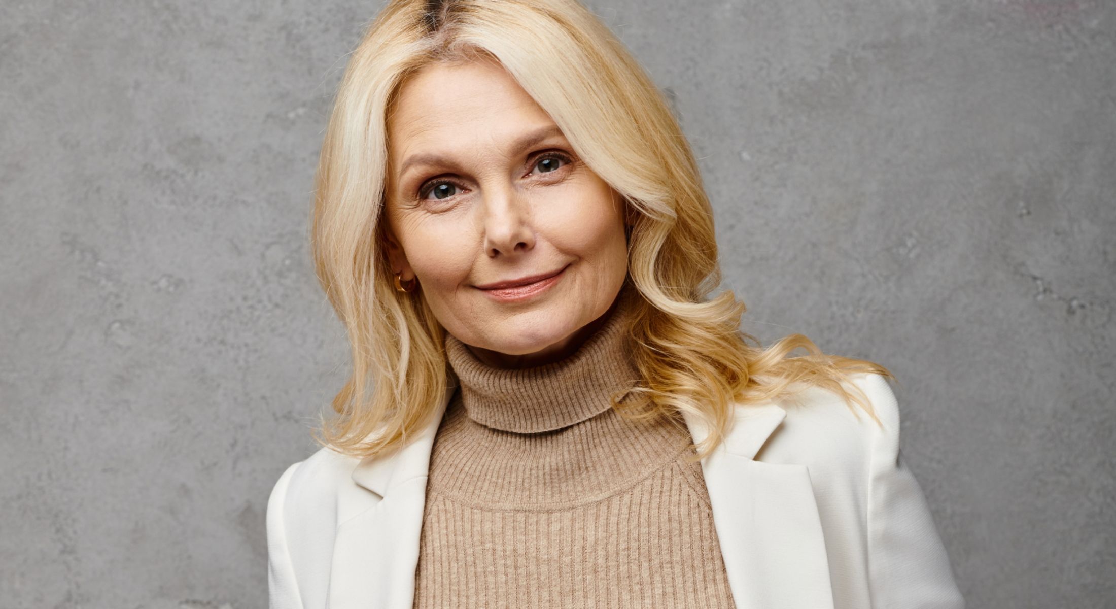 Portrait of a woman with blonde hair.